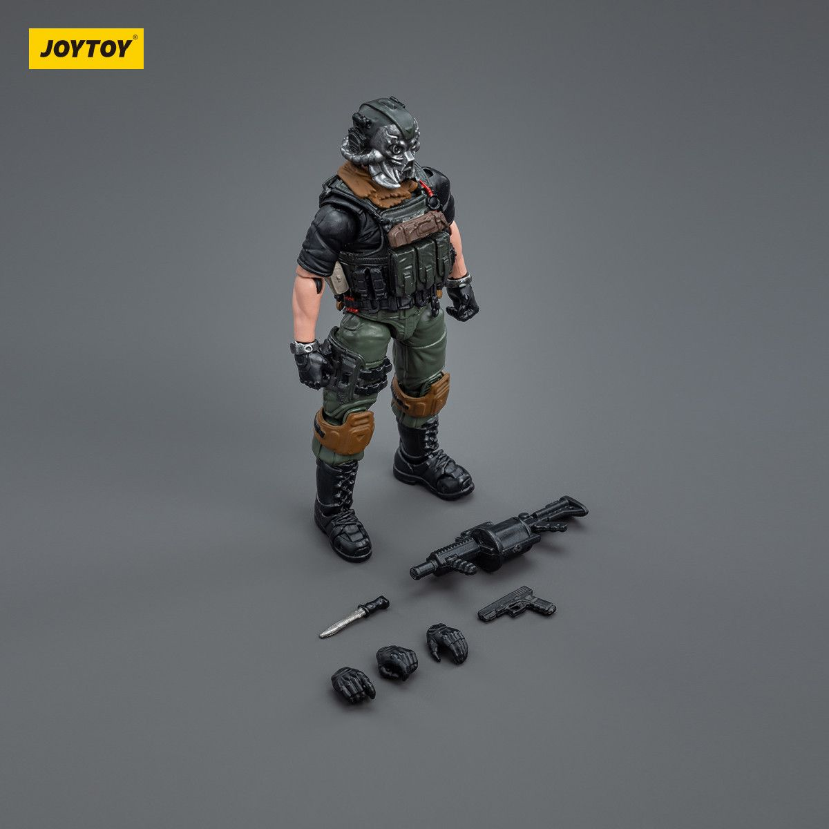 Action figure with accessories on a gray background, featuring the JOYTOY brand.