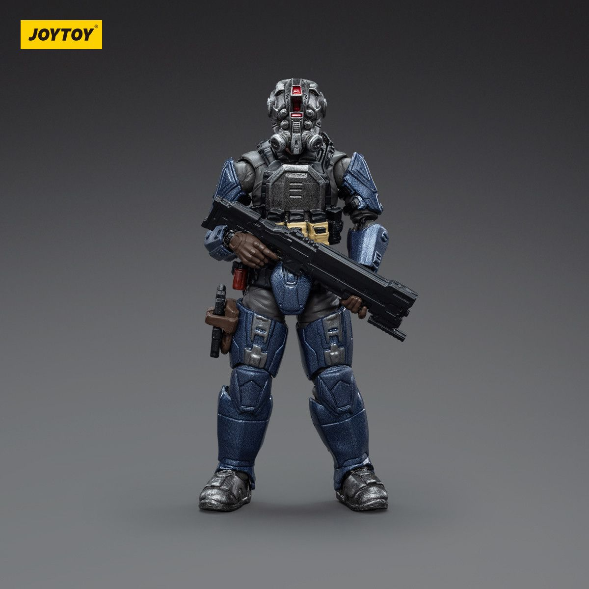 Toy figure of a character in futuristic armor holding a weapon on a gray background with 'JOYTOY' branding.