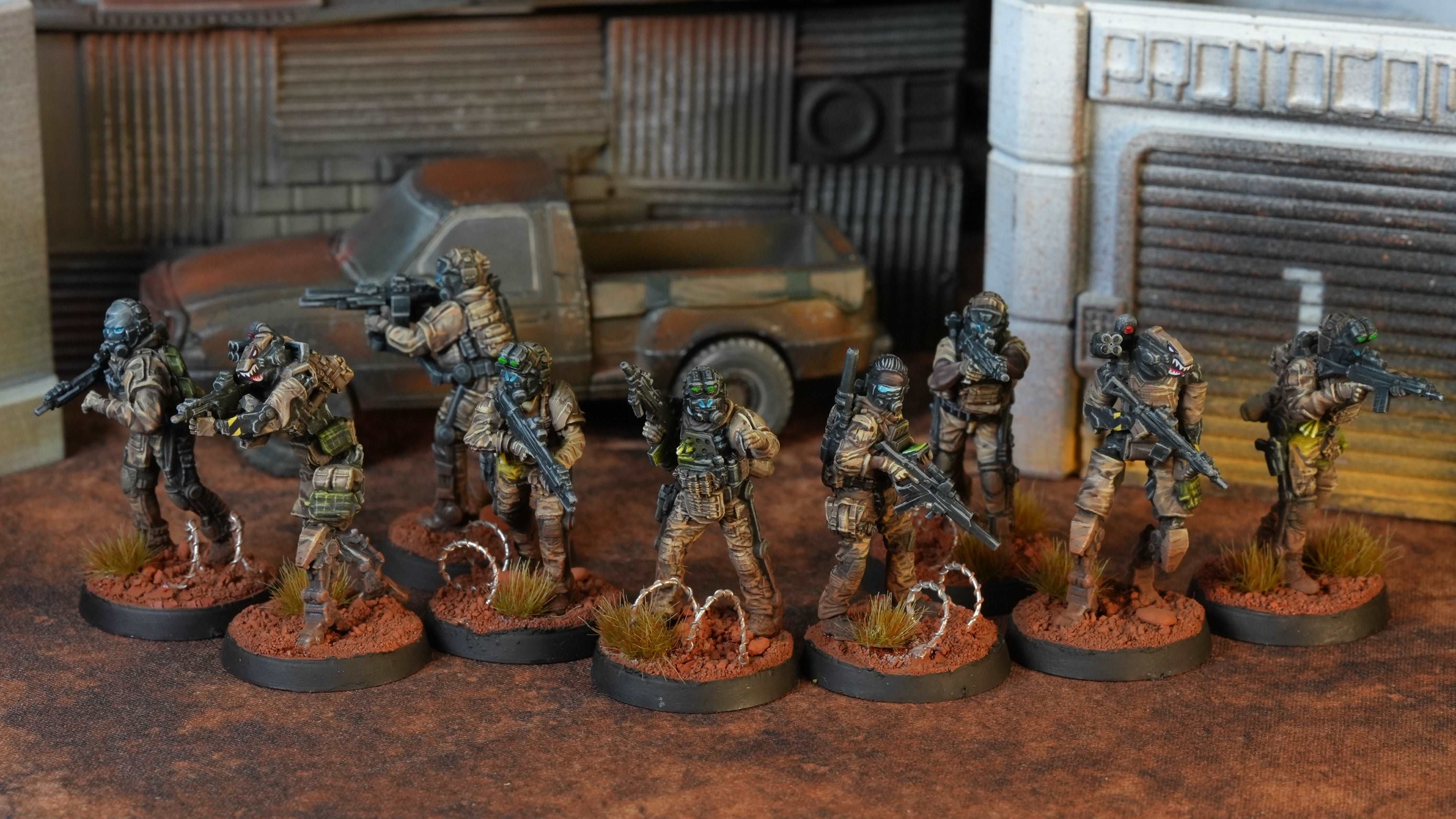 Collection of miniature soldiers on stands with a textured background