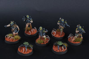 Set of miniature figures on round bases with a dark background