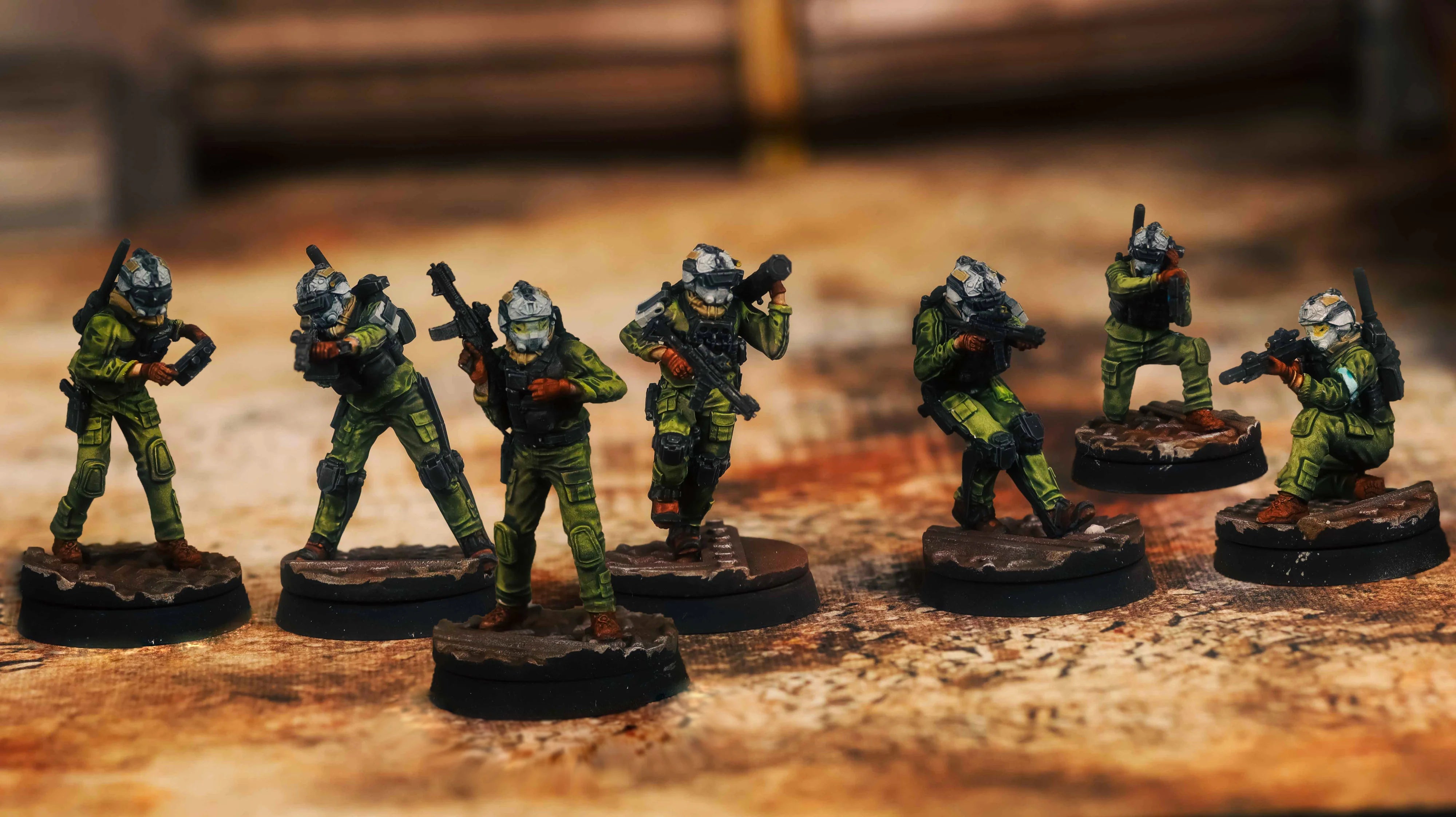 Set of miniature figurines on a wooden surface