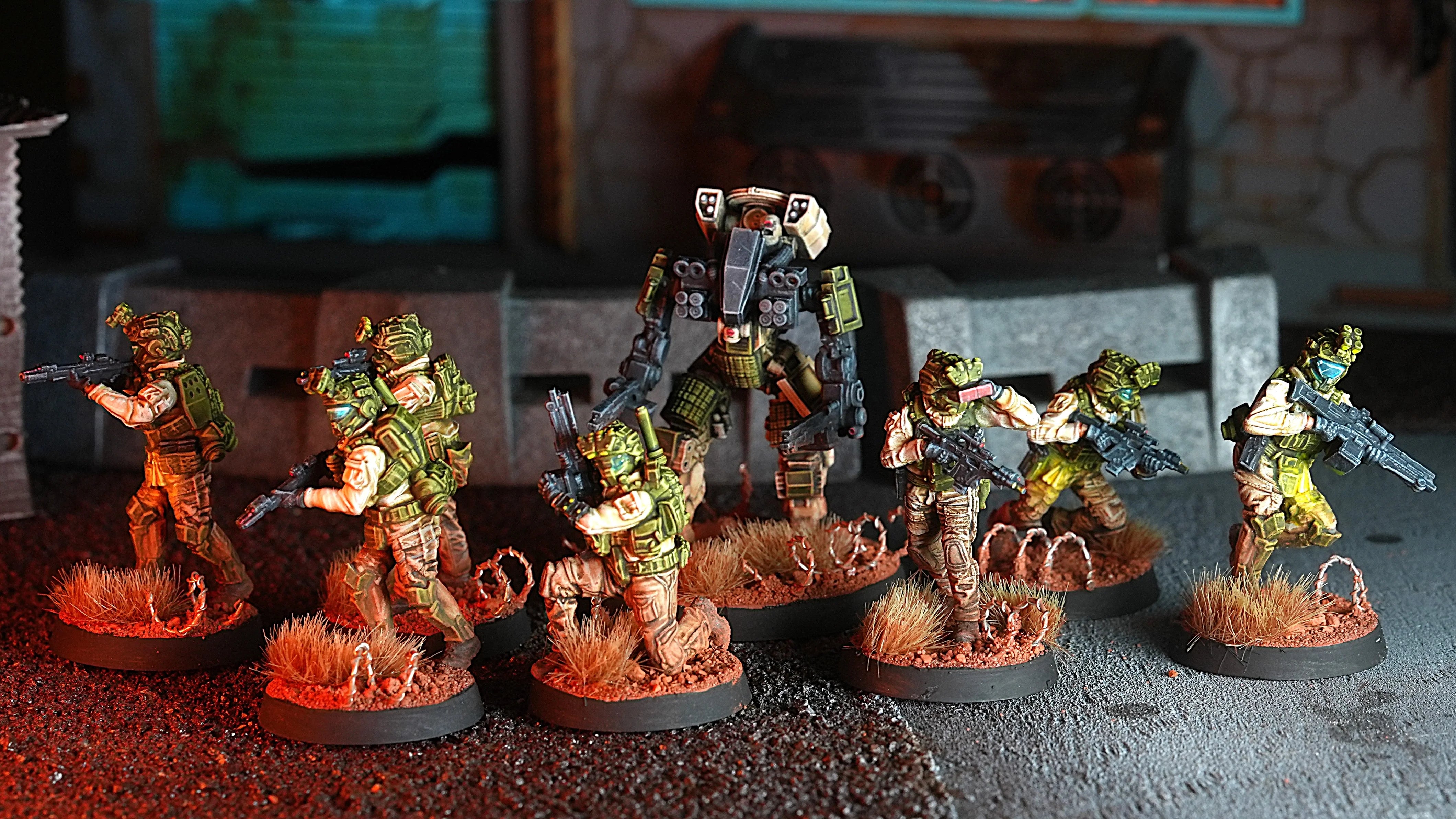 Collection of miniature figures on a dark surface with a blurred background