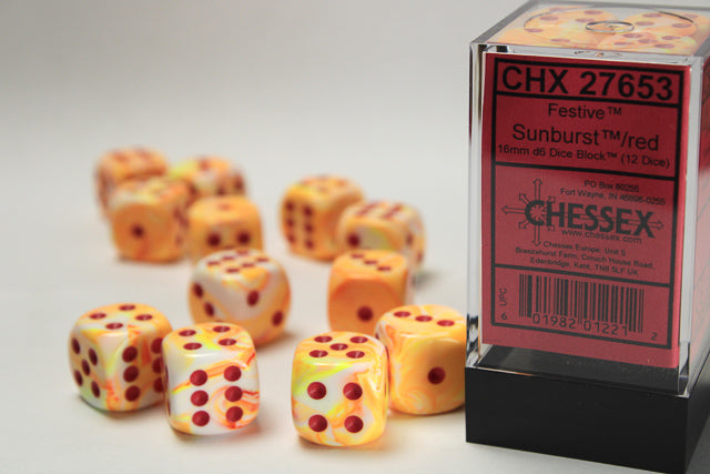 Set of Chessex dice with sunburst pattern next to their packaging
