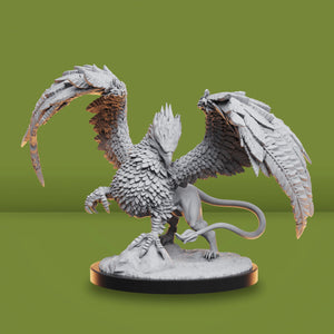Gray fantasy creature with wings on a green background