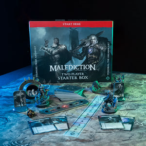 Board game set with 'Malediction' starter box and game pieces on a dark surface