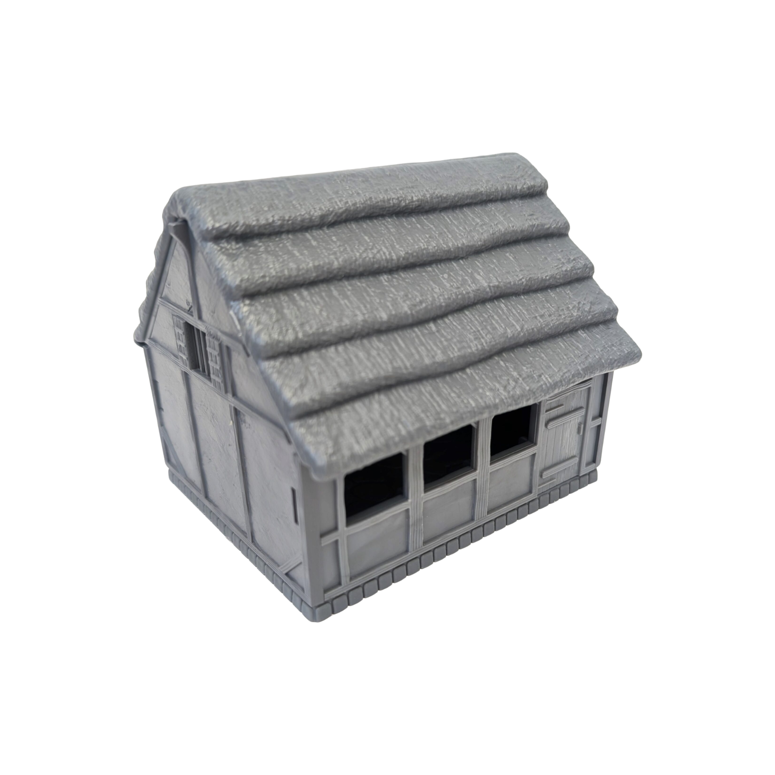 A small gray plastic model house with a textured thatched-style roof, shown on a plain white background.