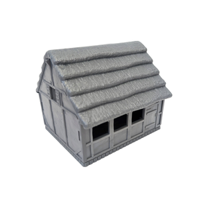 A small gray plastic model house with a textured thatched-style roof, shown on a plain white background.