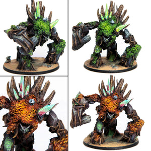 Four views of a detailed fantasy creature figurine with spiky armor and green moss-like textures.
