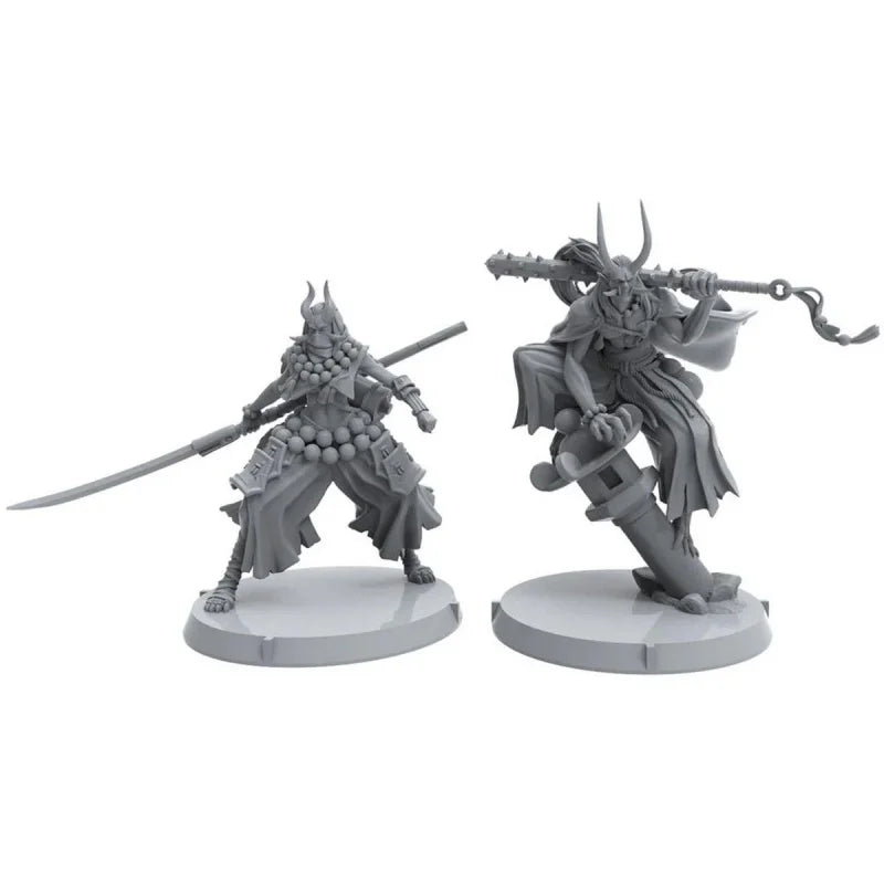 Two gray fantasy miniature figures on white stands with a white background