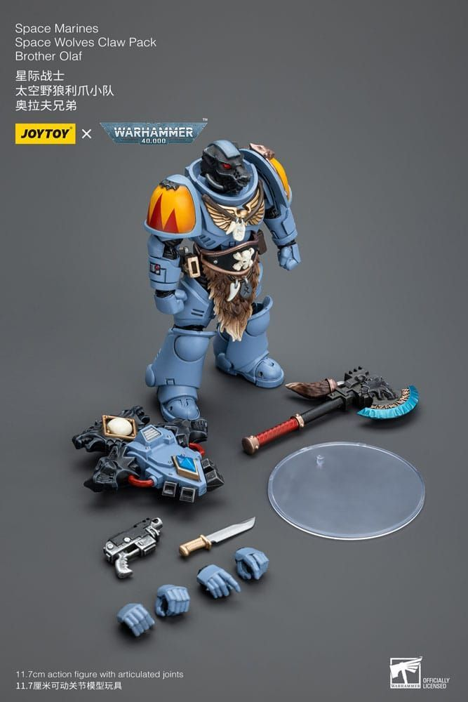 Toy figure of a Space Marine with accessories on a gray background