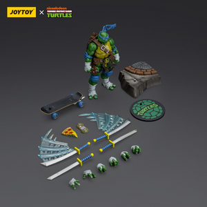 Toy figure of a turtle with accessories on a gray background, featuring Joytoy and Nickelodeon branding.